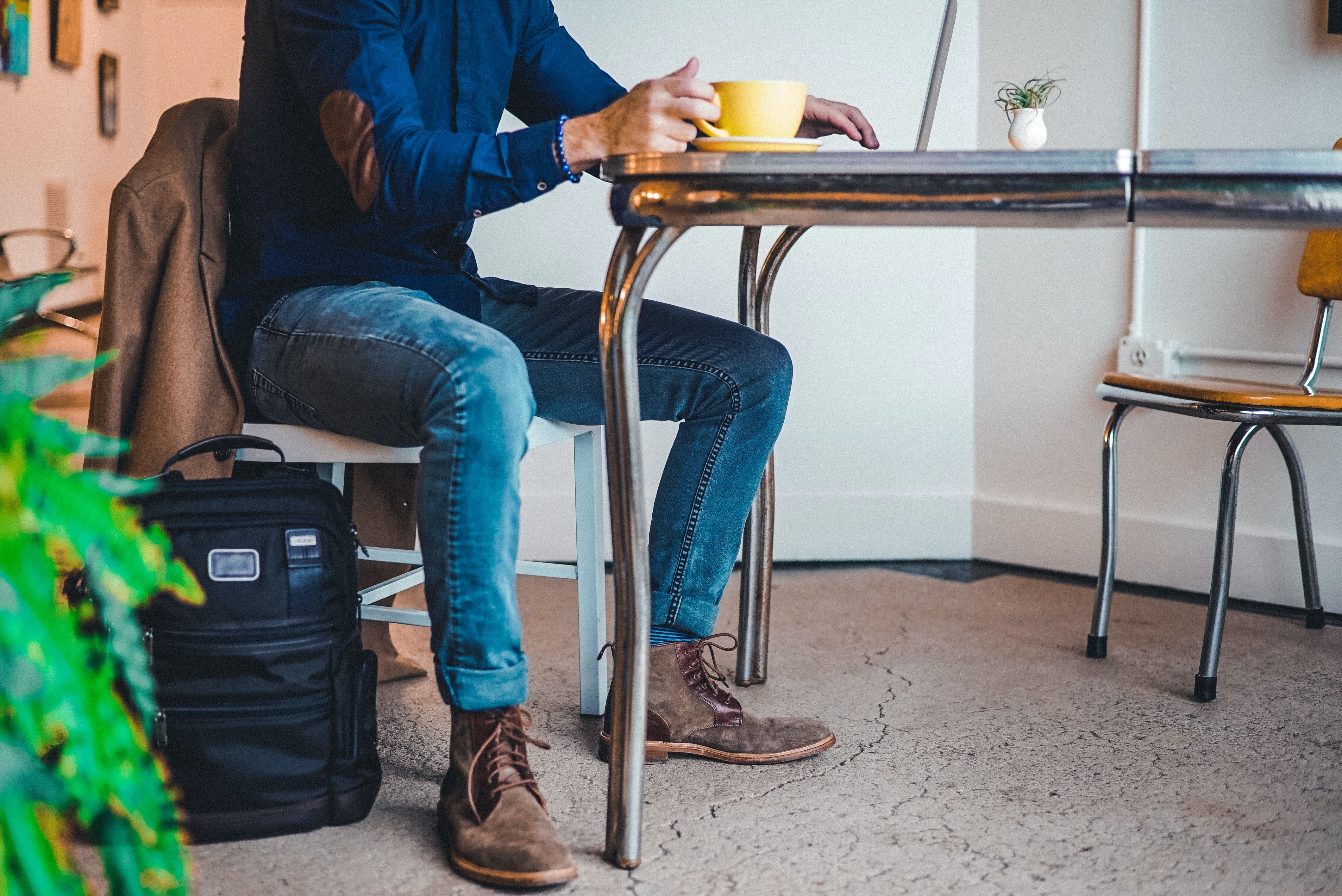 man taking break in cafe