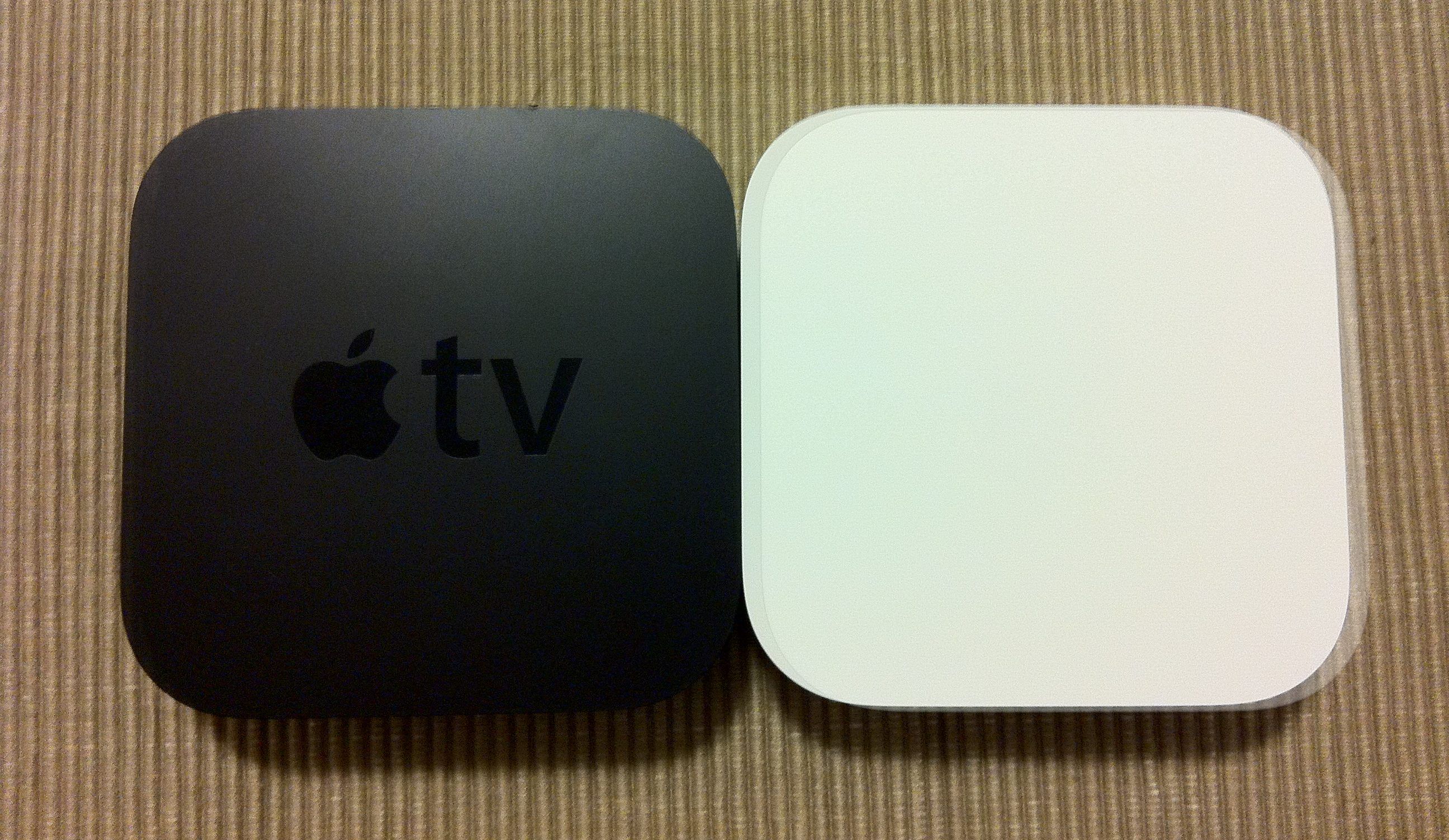 The square model of an AirPort Express router sits beside an Apple TV, showcasing their similarities