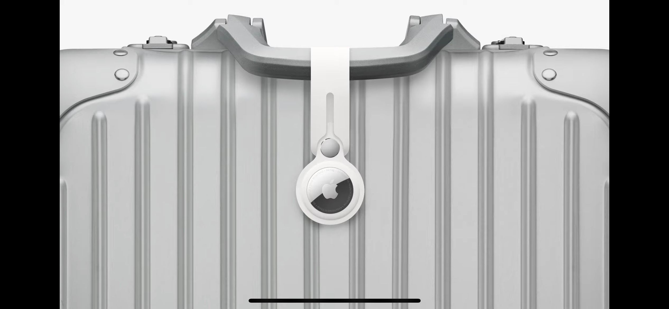 Apple Airtag Attached to Silver Briefcase
