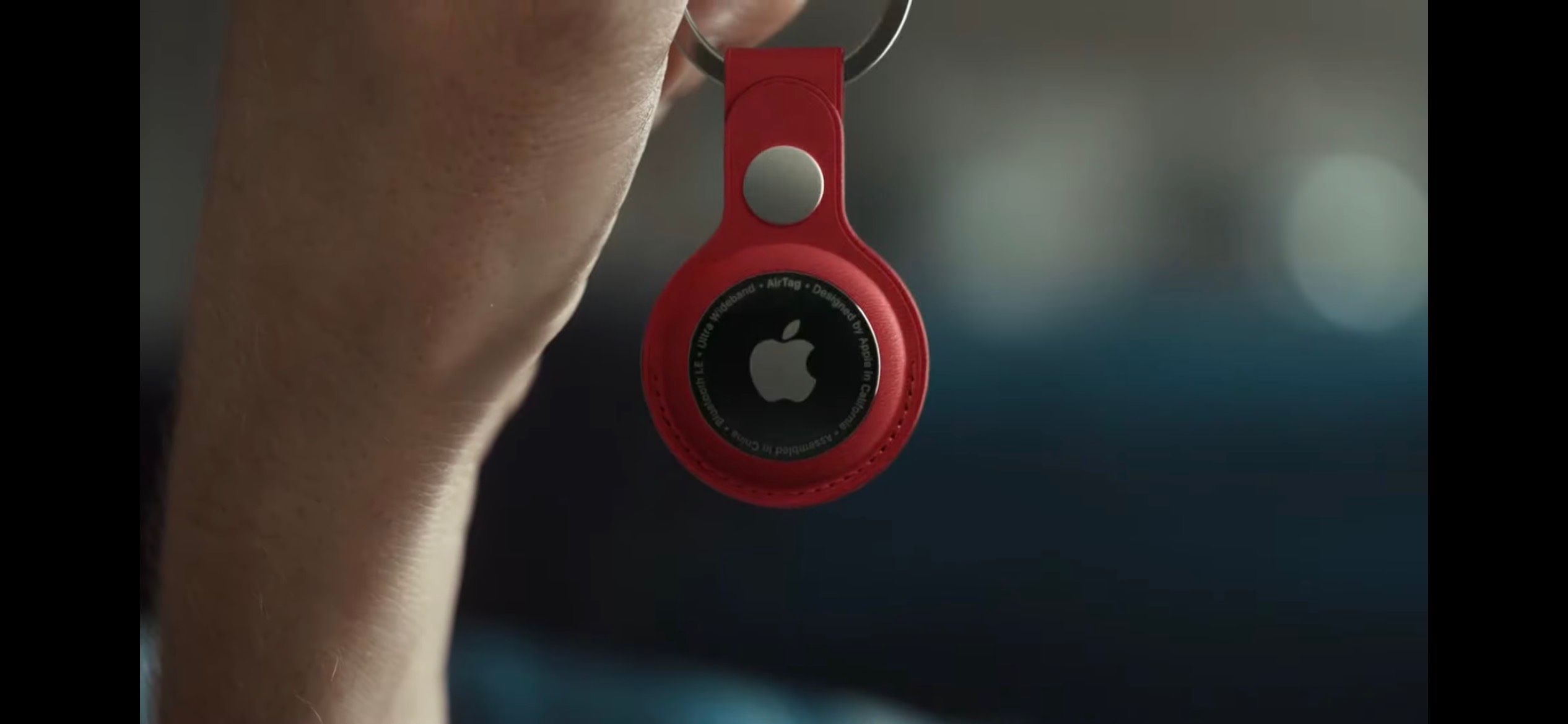 Apple Airtag on Red Keychain in Hand
