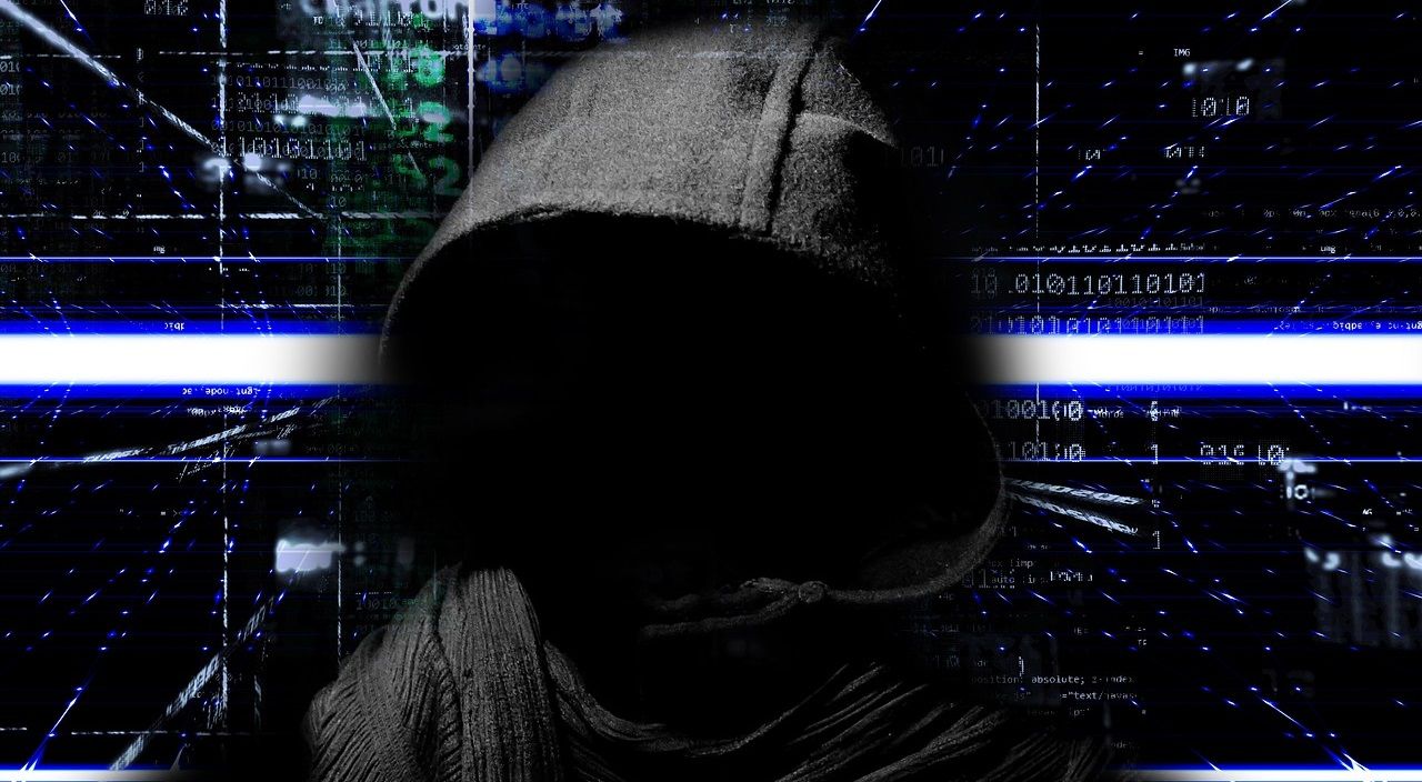 Ist Web Scraping illegal? - Face covered in a hoodie demonstrating cybercrime 6