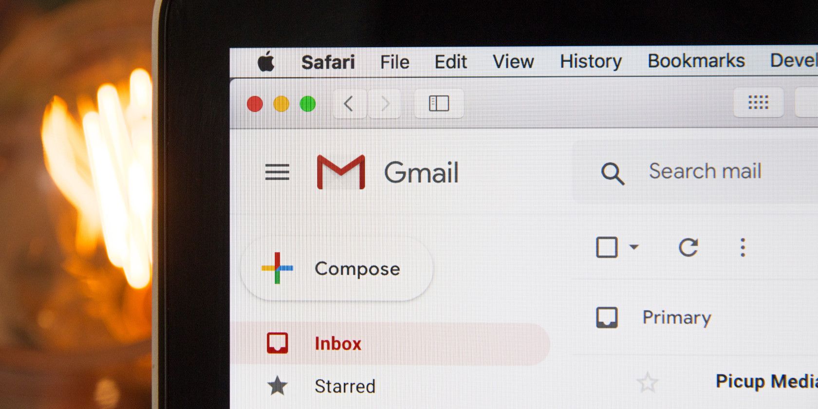 Gmail inbox on a MacBook screen.
