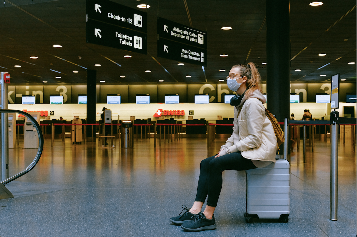 Girl on Airport Wearing Mask