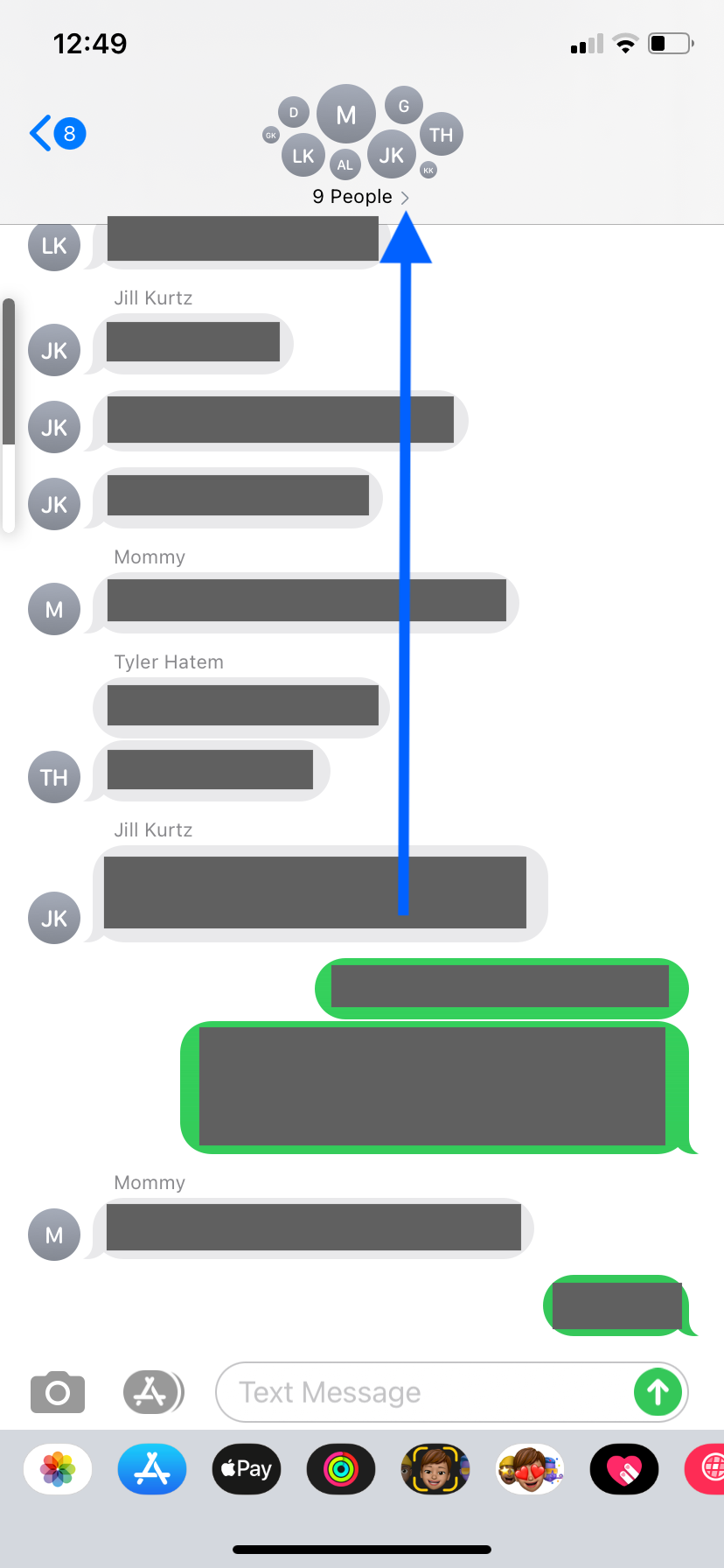 The window of an SMS group chat on an iPhone. An arrow points to a menu arrow in the name section