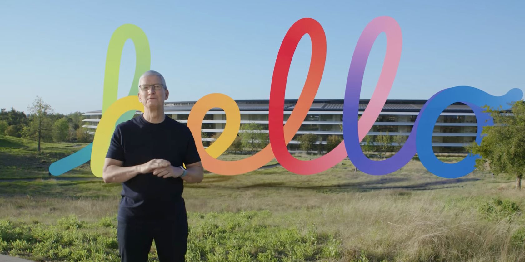 Tim Cook talking at Apple Park with the Hello graphic at the Spring event