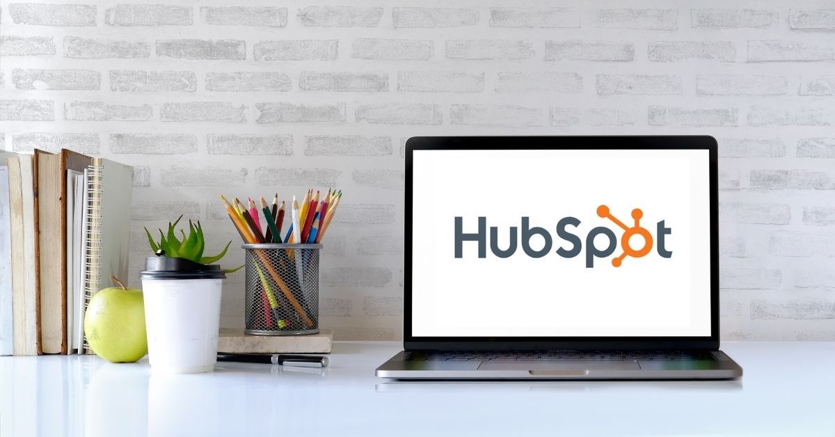 Laptop on table with Hubspot logo on screen