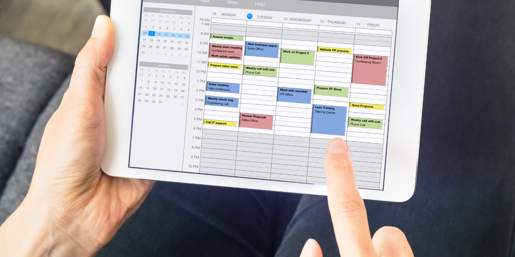 Woman Using Google Calendar on Tablet