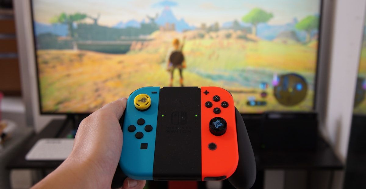 A docked Nintendo Switch, playing The Legend of Zelda: Breath of the Wild.