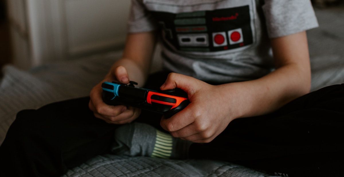 A person playing with a docked Nintendo Switch.