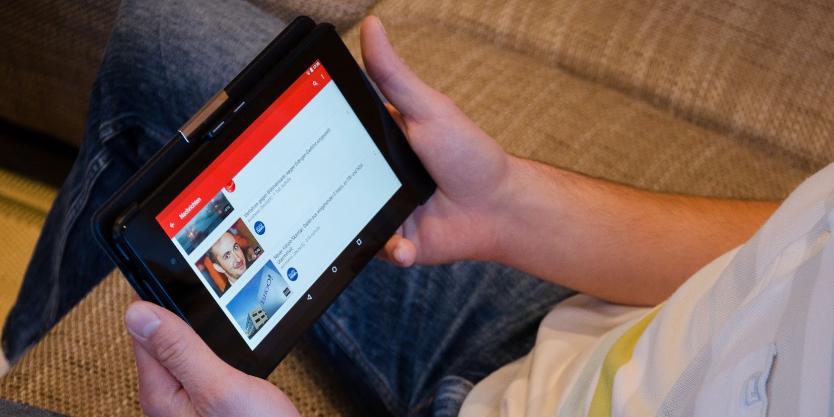 A person using YouTube on a tablet