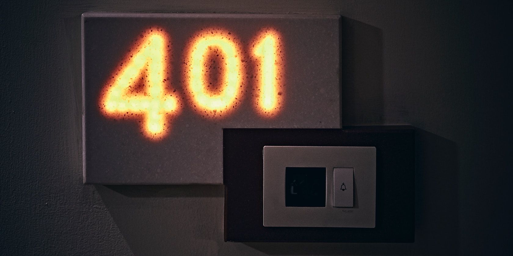 An image of an illuminated door number reading '401'