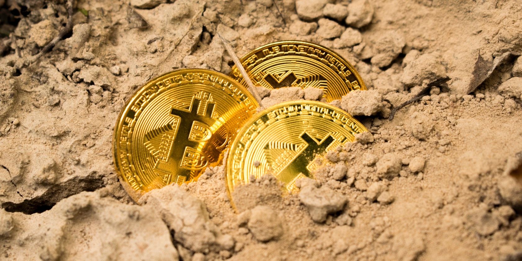 Bitcoin in sand