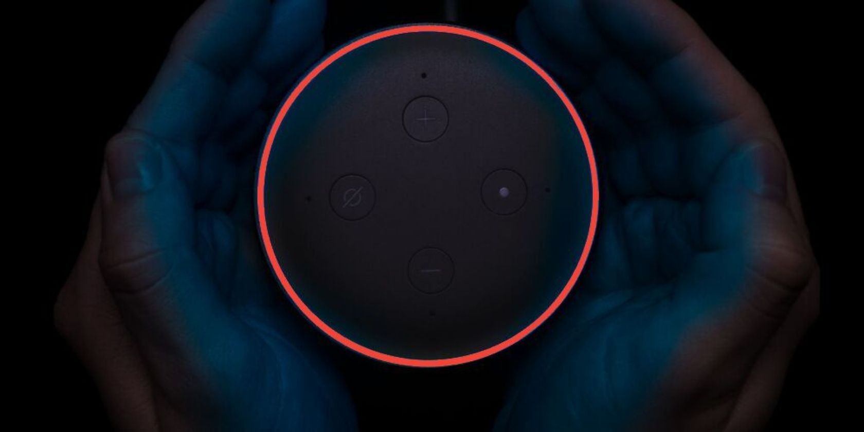 Hands holding Amazon Echo with red ring