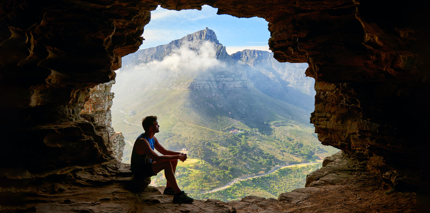 A man sitting in a cave