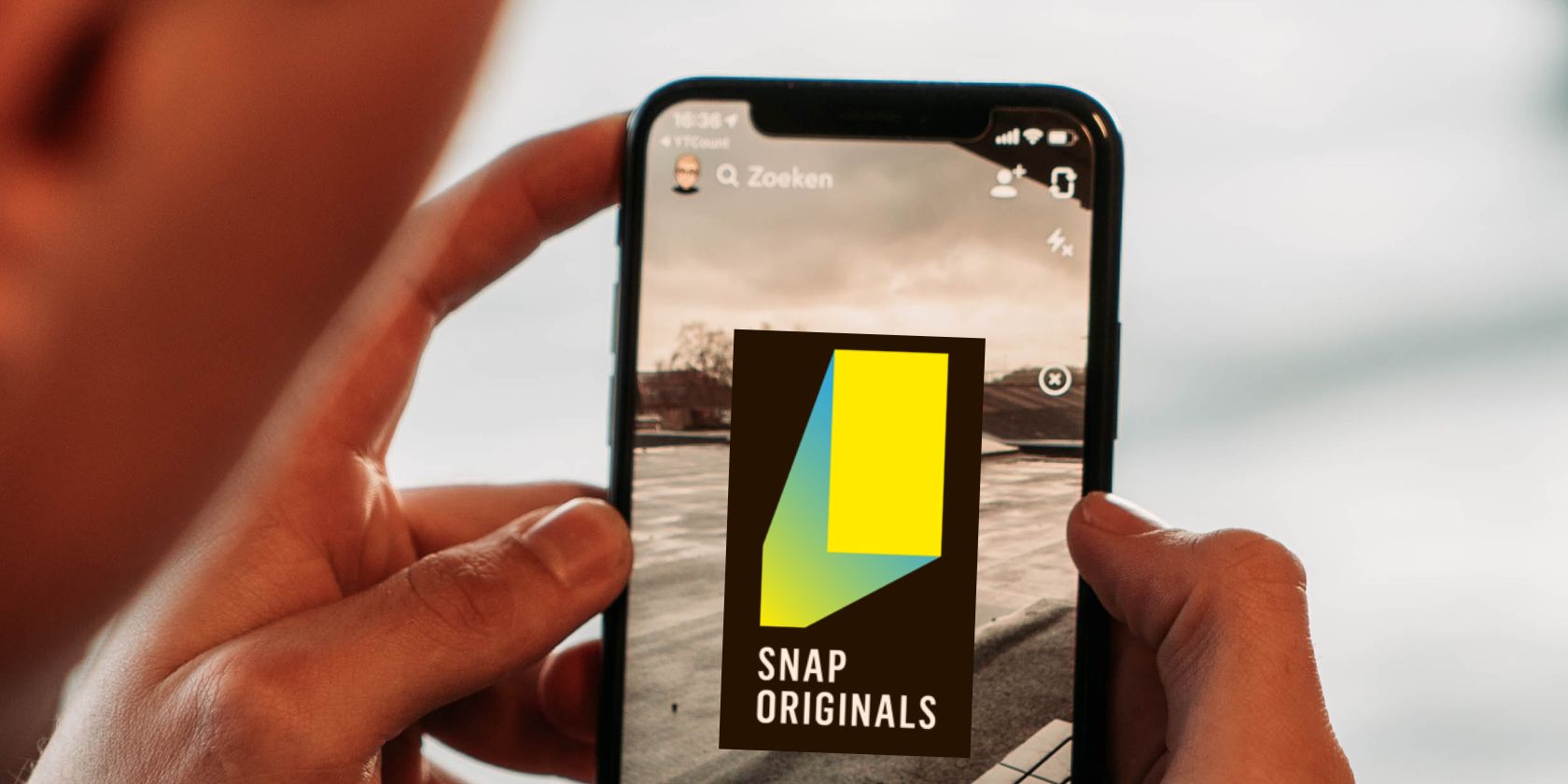 A close-up of a phone using Snapchat with the Snap Originals logo on the display