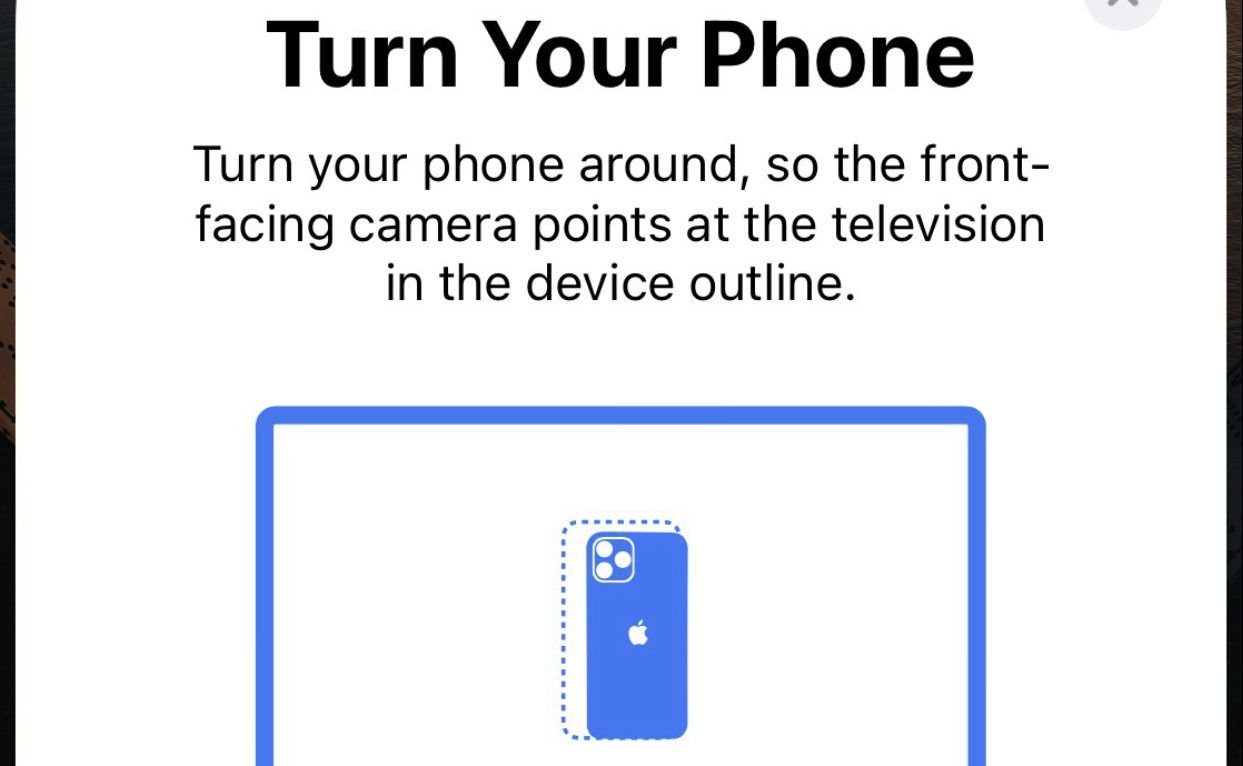 Screenshot from the iPhone telling you to turn your iPhone around to begin the process
