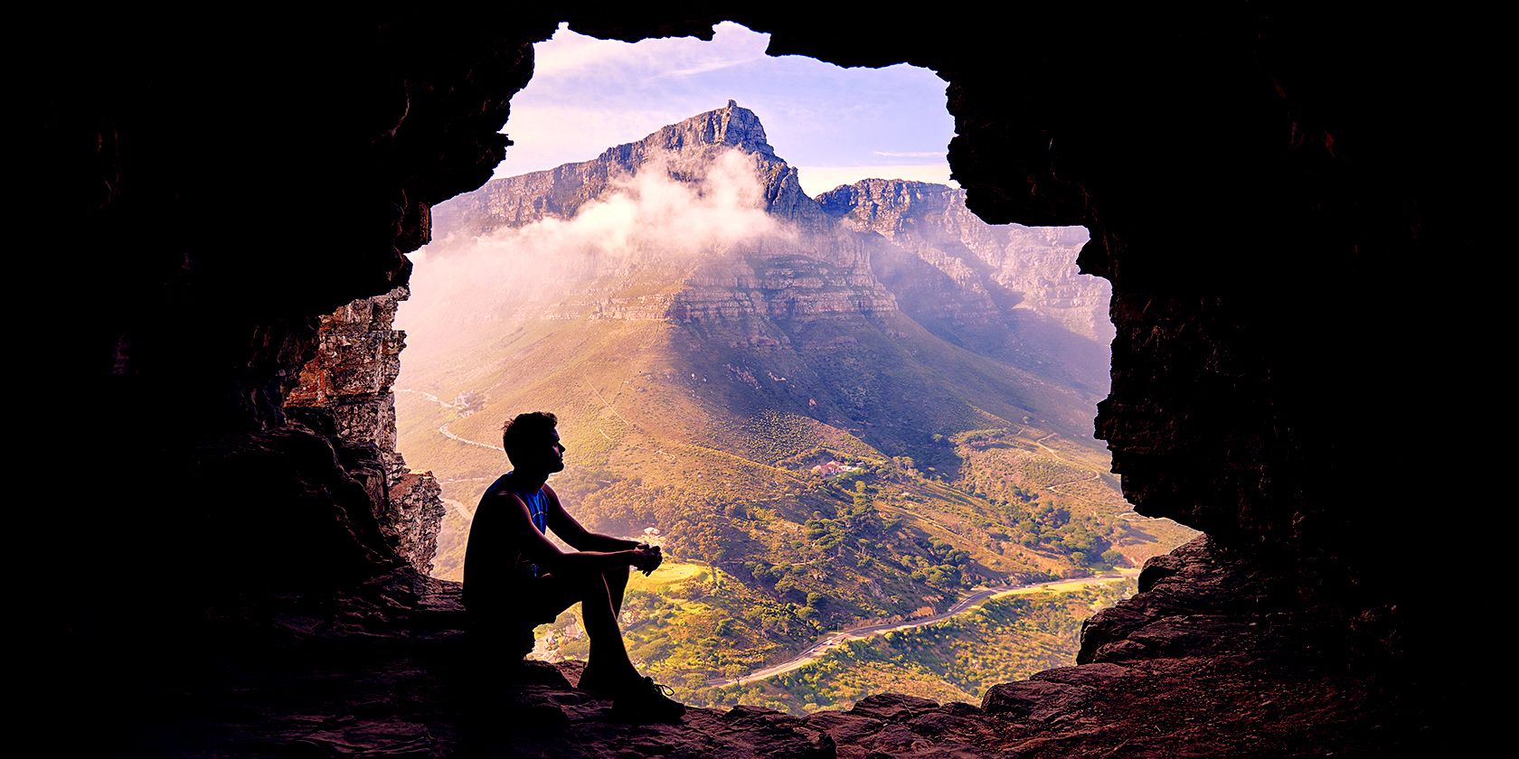 Man sitting in cave
