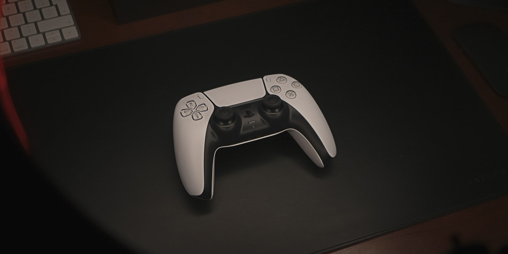 PS5 controller on a black table