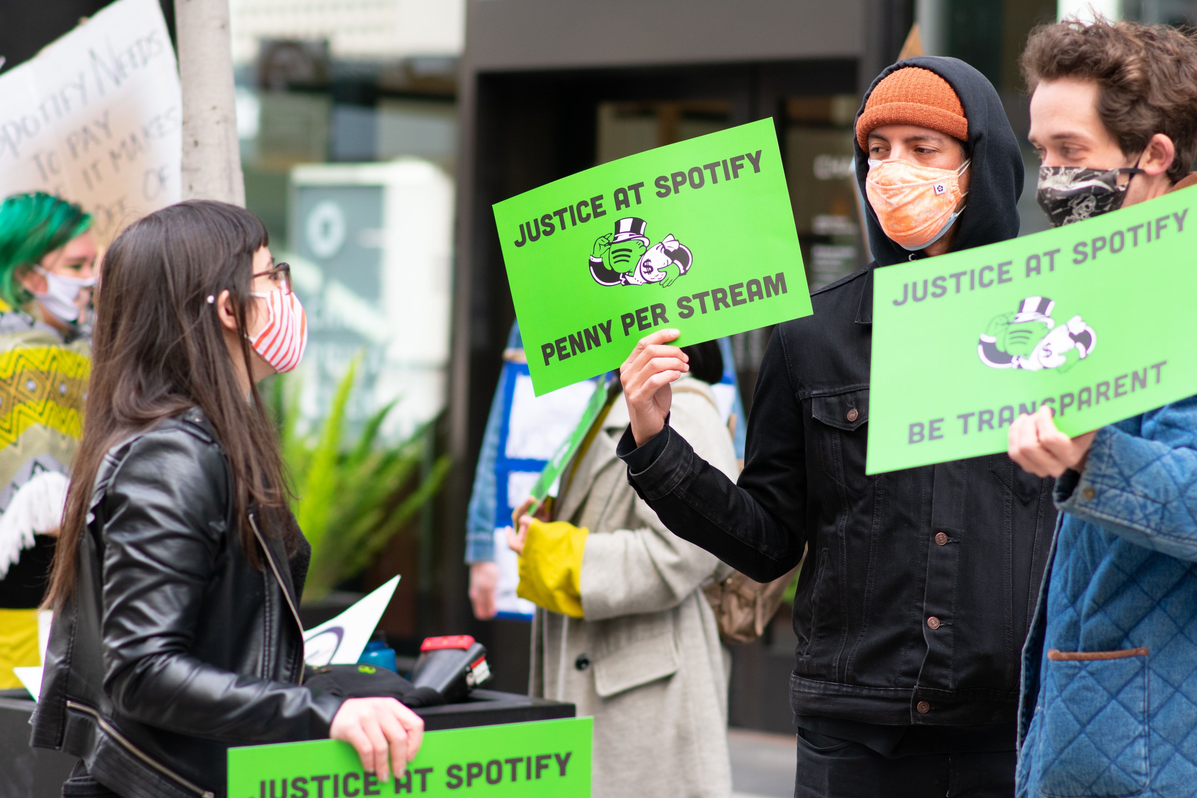 people protesting against spotify's payments per stream