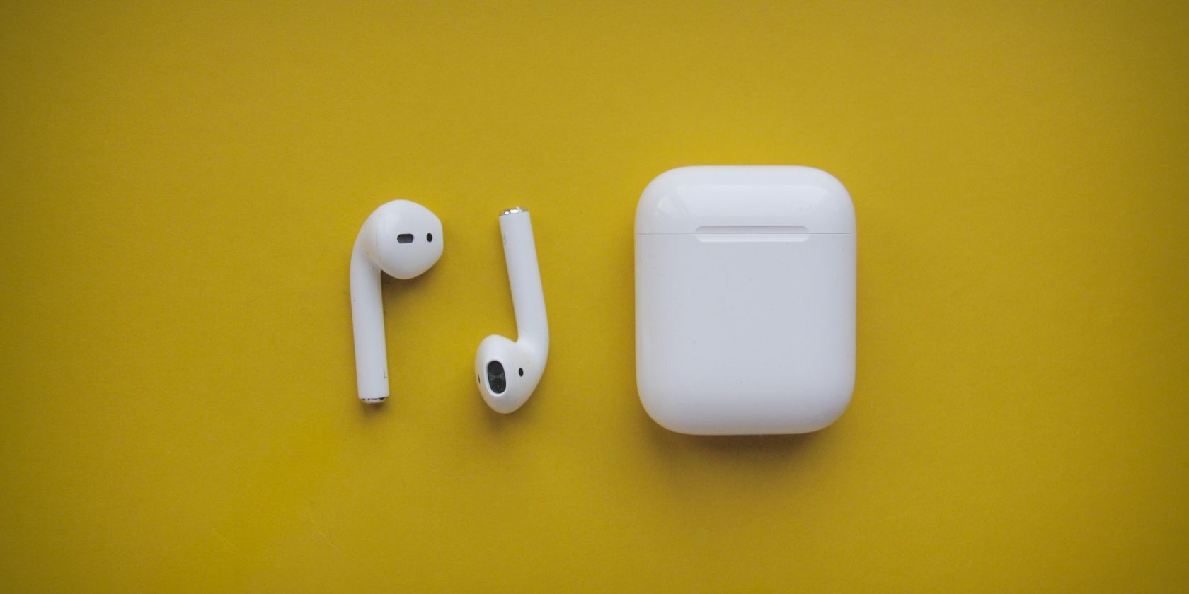AirPods and their case photo