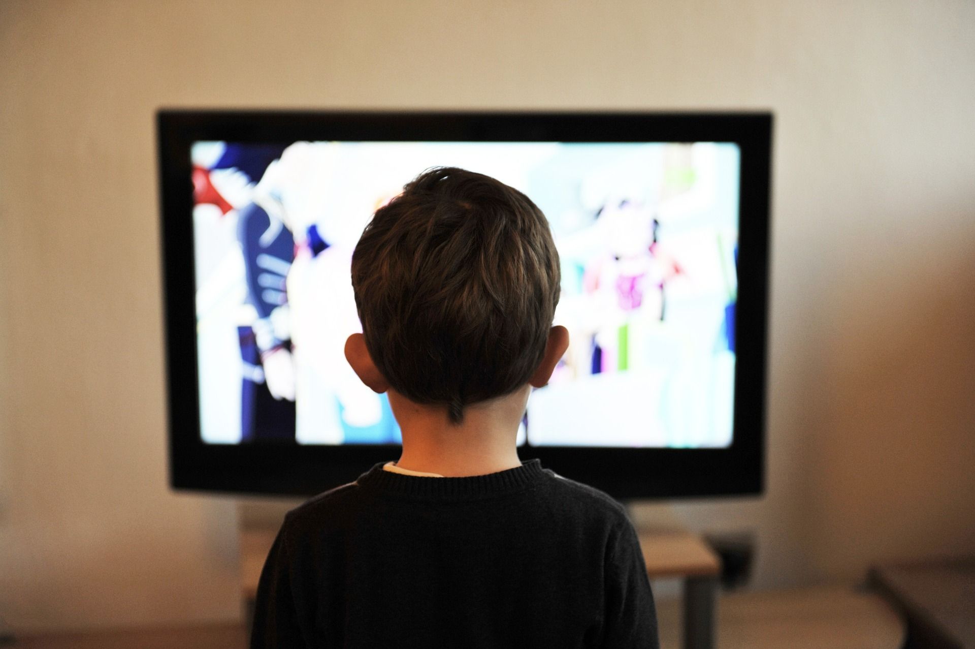 young child watching television