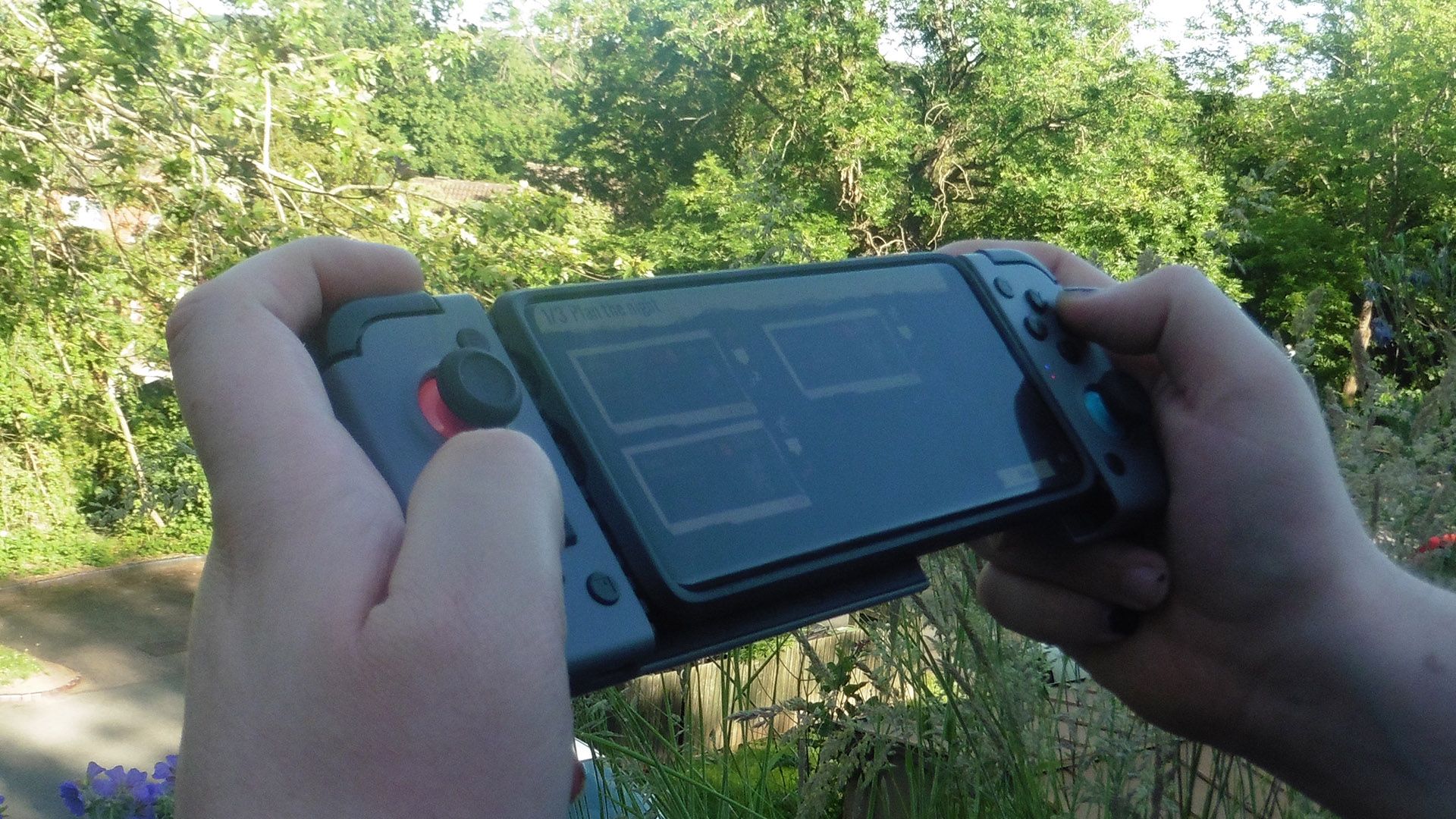 GameSir X2 Bluetooth Controller Being Played Over Sunny Background