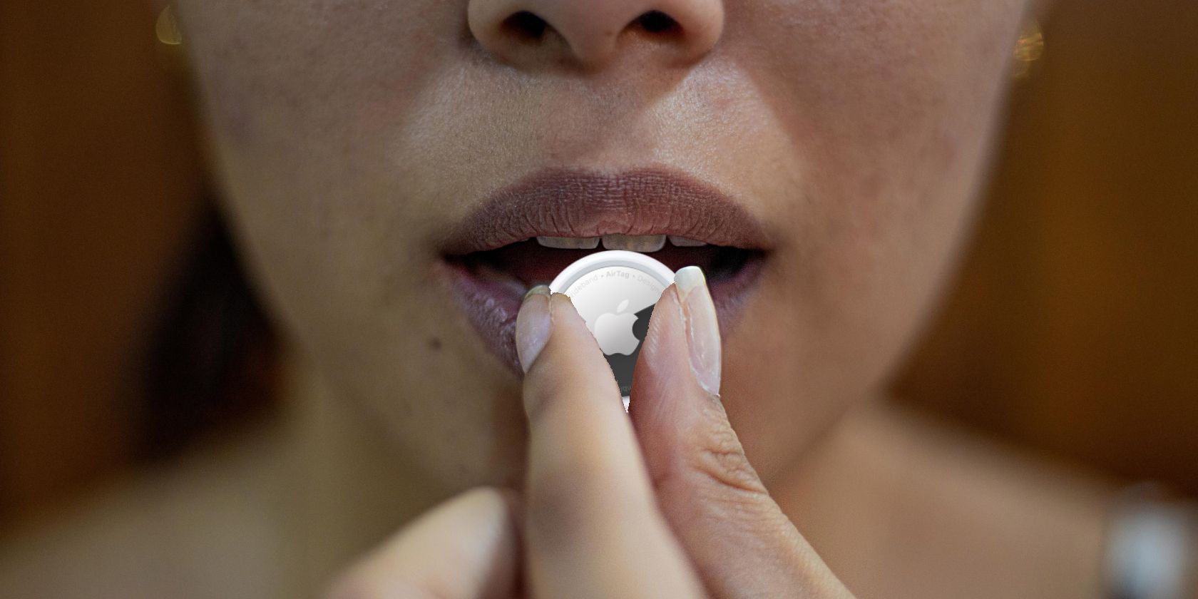 Image showing a woman holding an AirTag to her mouth as if it were a pill