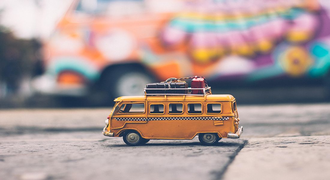 a toy bus on paved way