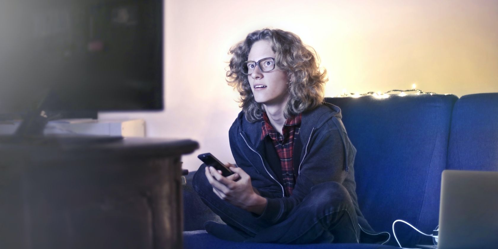 Person with Glasses Watching TV