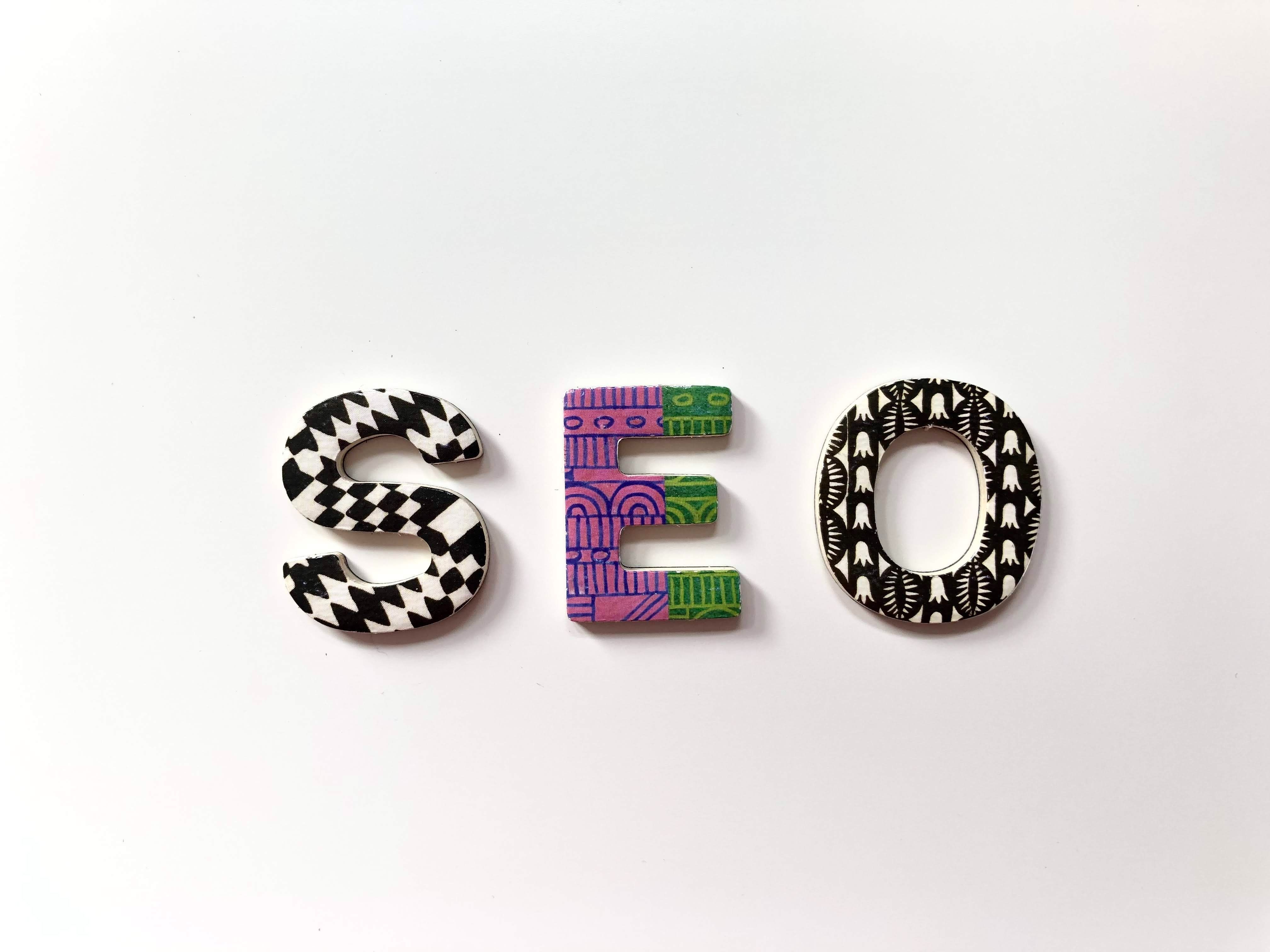 SEO capital letters with a graphic pattern