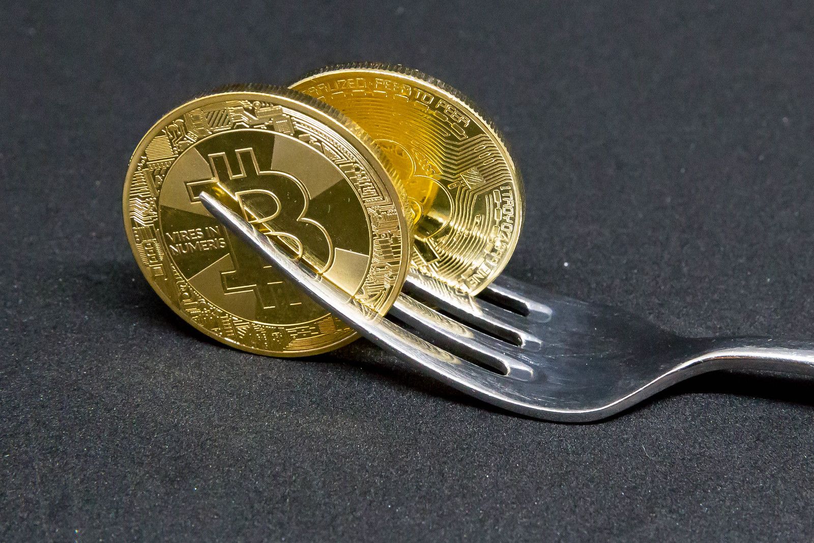 Flickr photo of two Bitcoins in between a fork