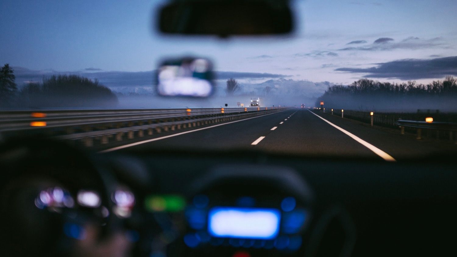 View of road ahead through car windshield