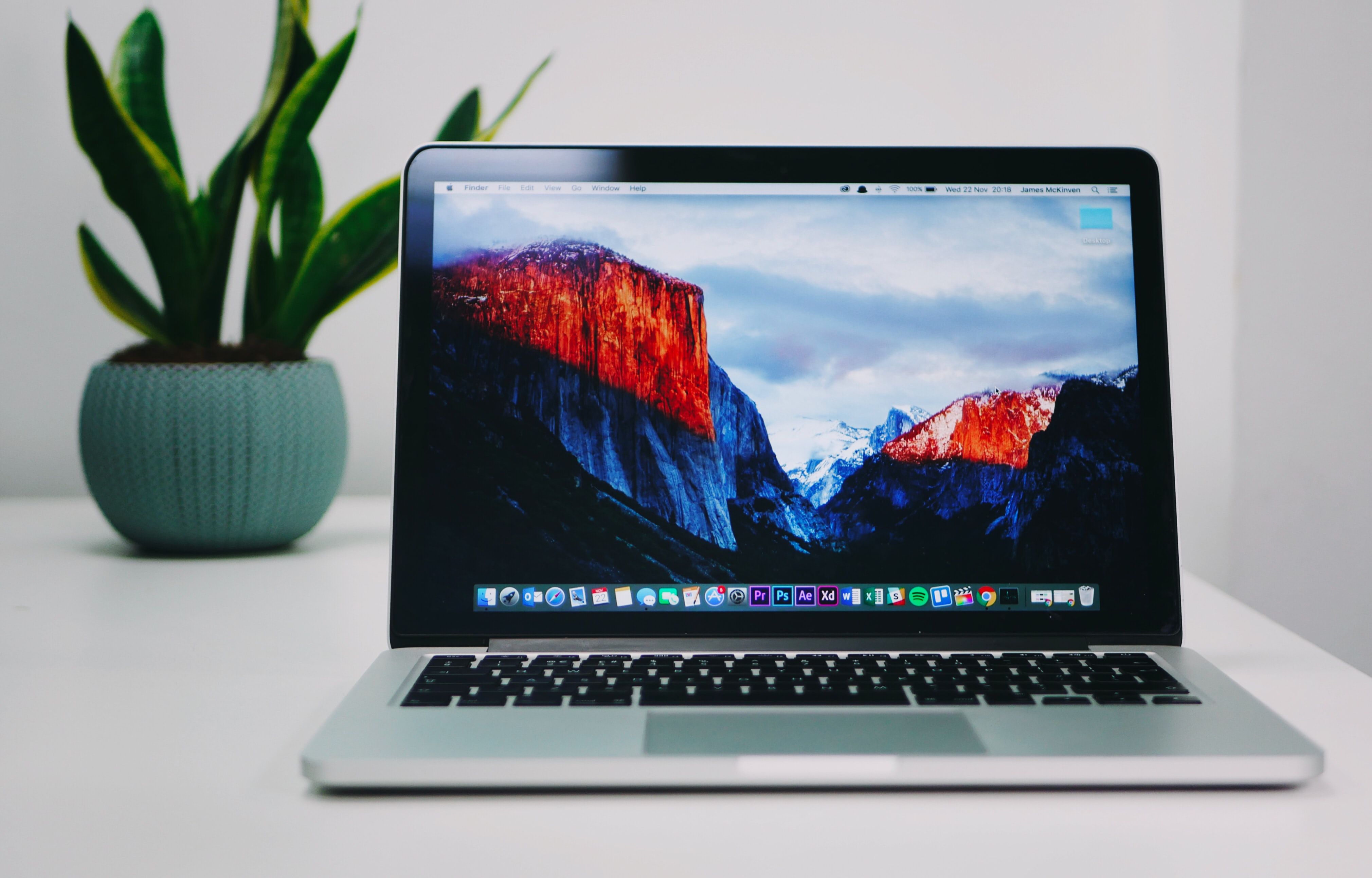 Photo of Macbook on top of desk