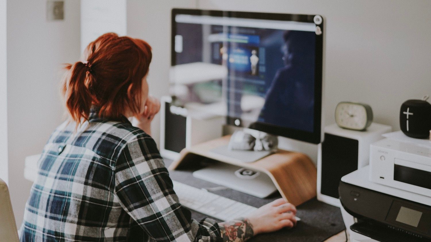 Person working at desk with computer