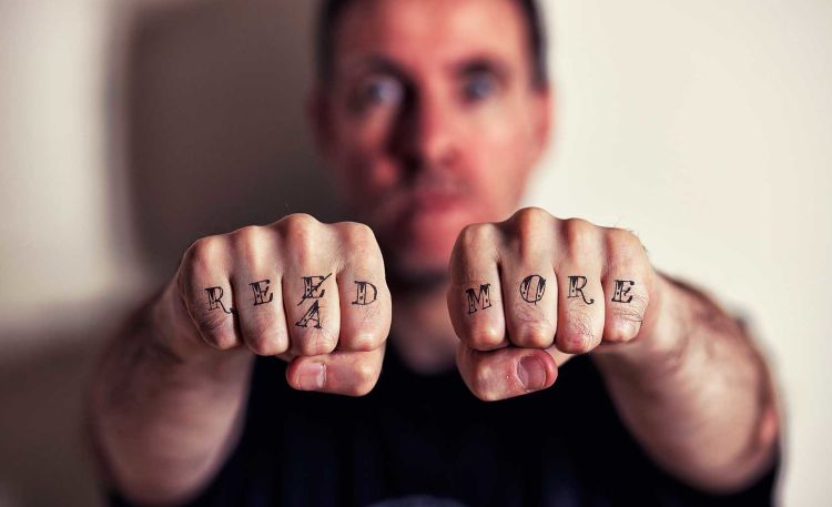 read more plea tattooed on knuckles