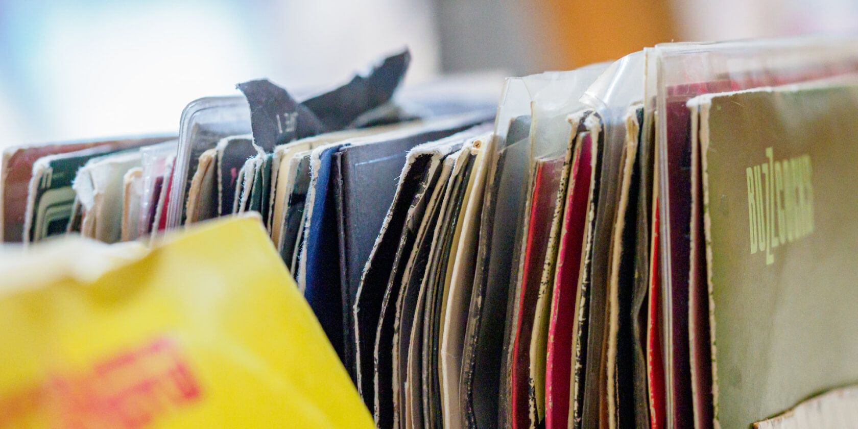 Photo of books and papers stacked up against each other