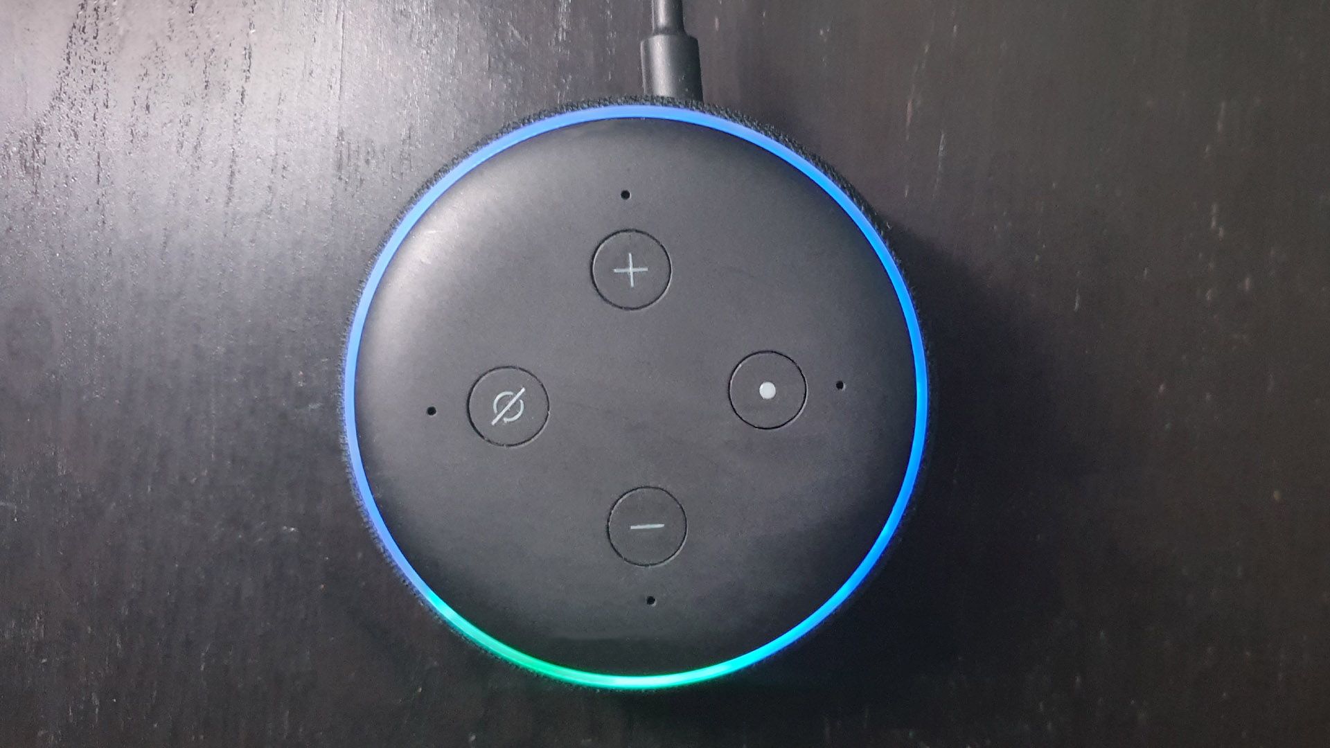 Echo Dot With Blue And Cyan Light Top Down View