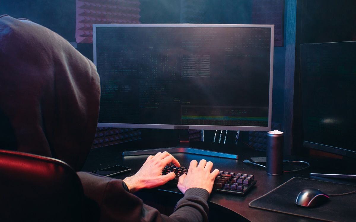 Photo of a potential hacker using a PC