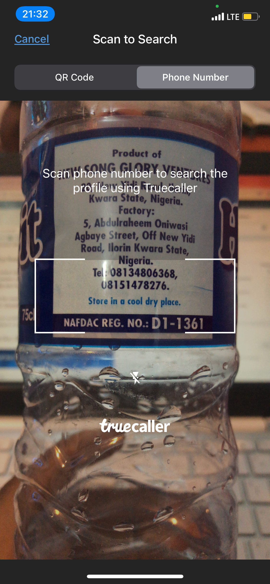 Truecaller Scan feature scanning a phone number on a bottle