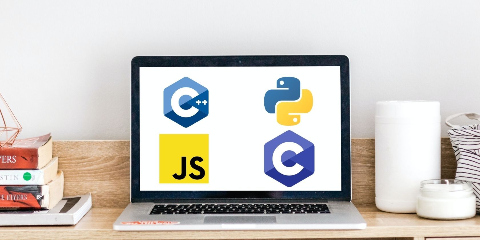 Laptop screen with C++, Python, JavaScript, C
