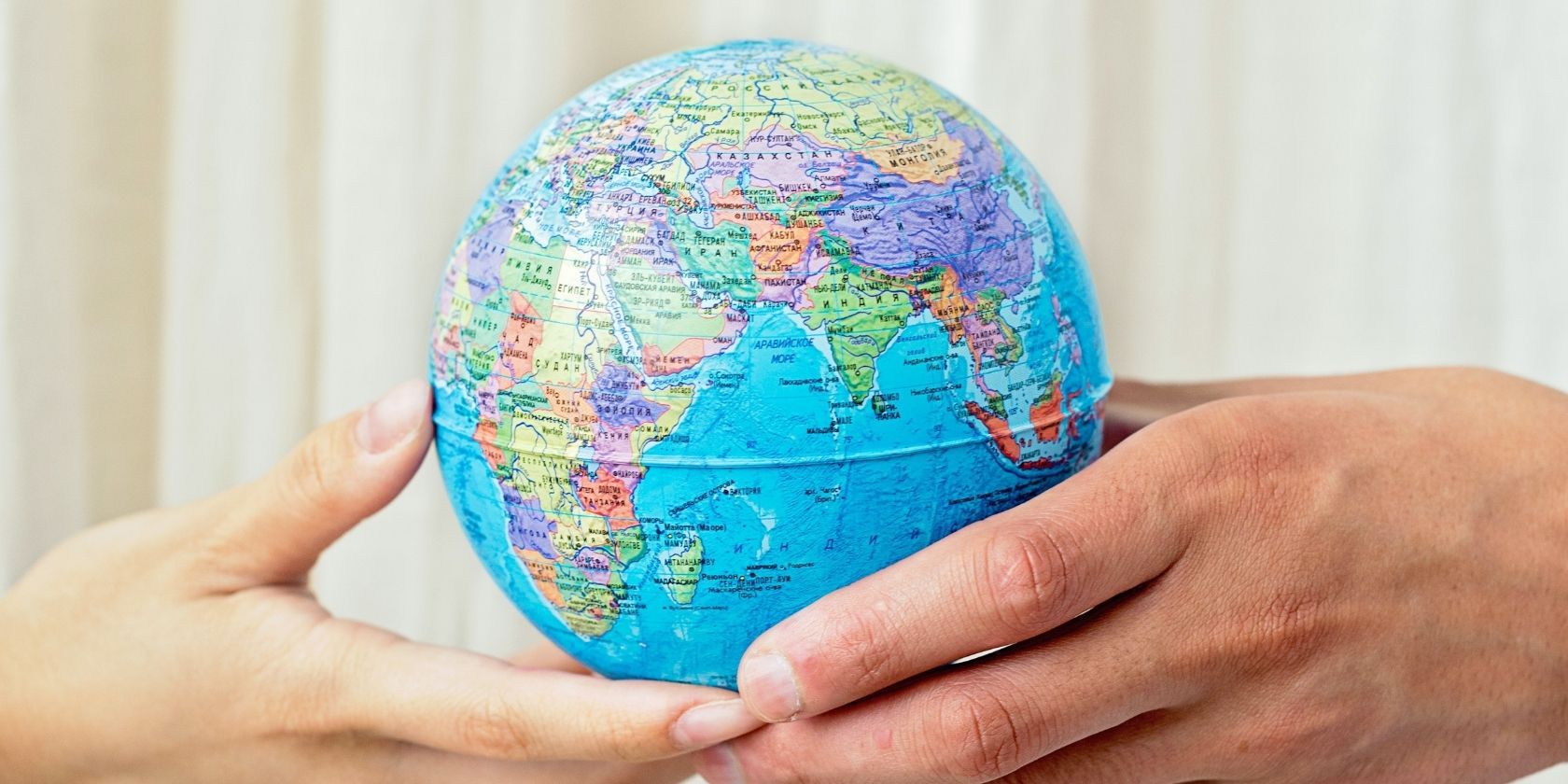 Small Globe Held With Two Hands