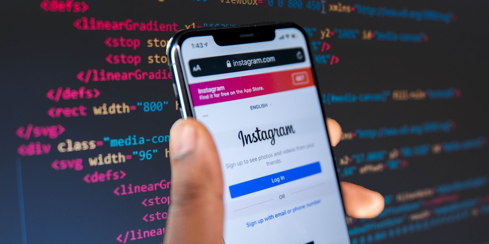 Phone with Instagram on in front of algorithm code