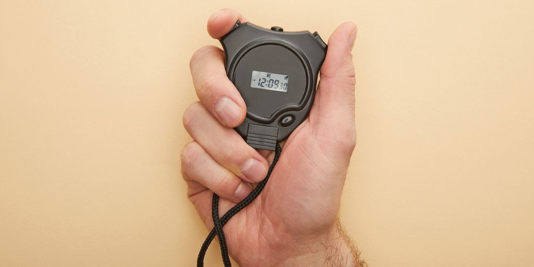 A man holding stopwatch
