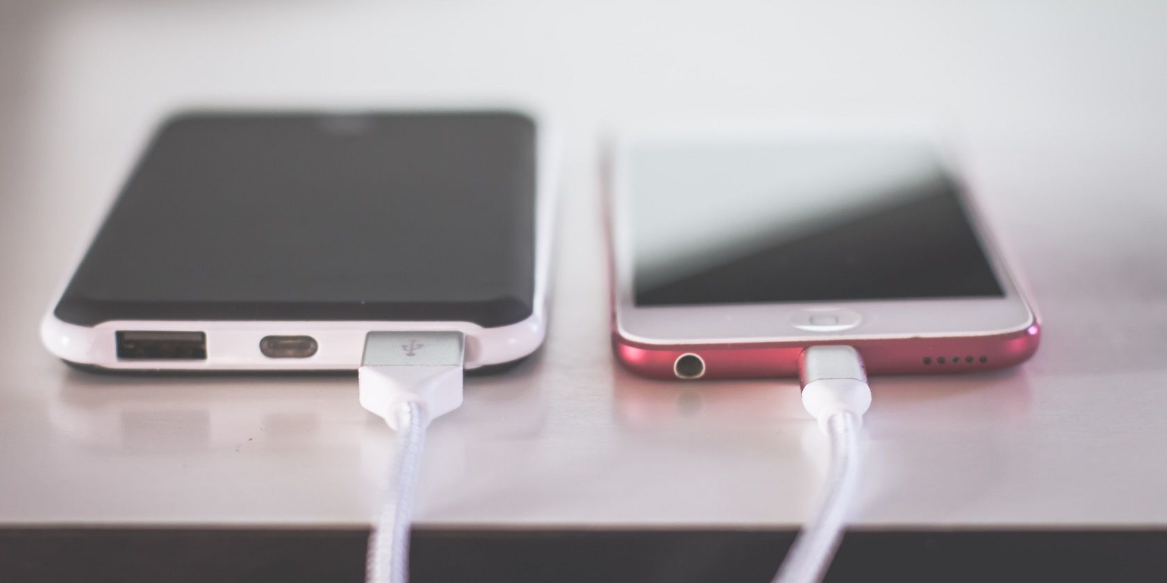 Photo of two phones charging next to each other