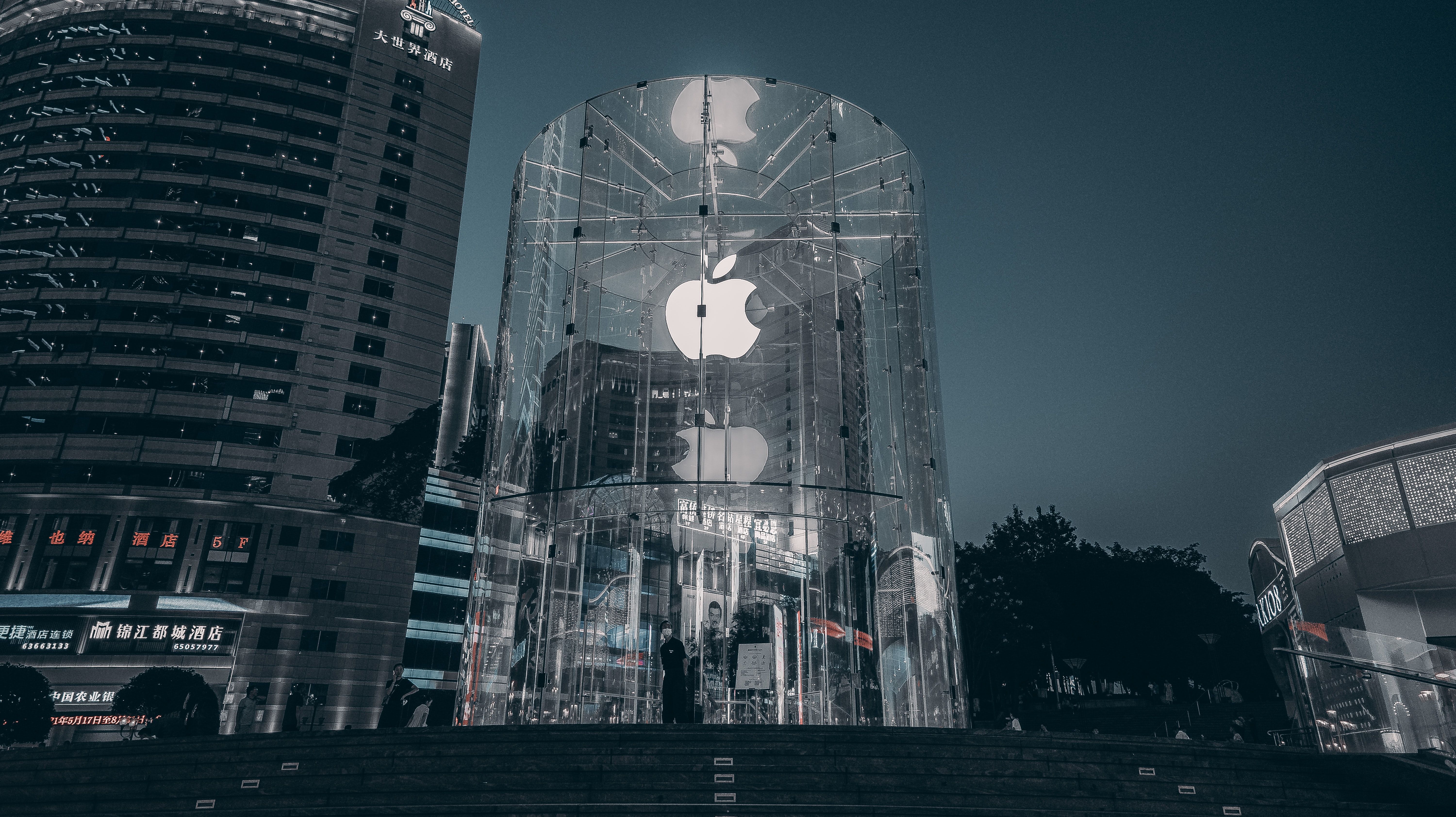 Photo of the Apple logo showing on the side of a building