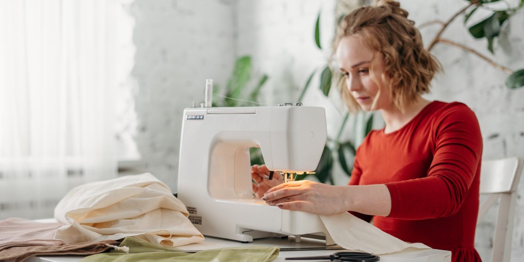 A fashion designer sewing