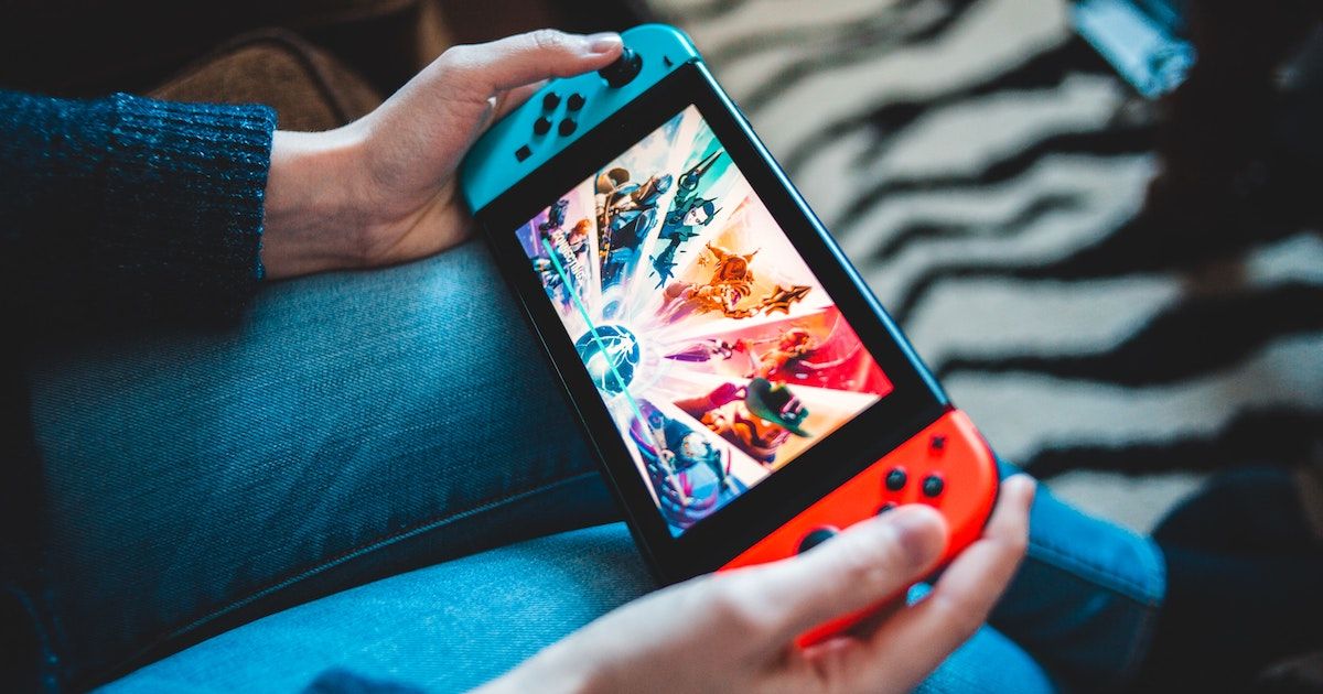 A person playing a Nintendo Switch