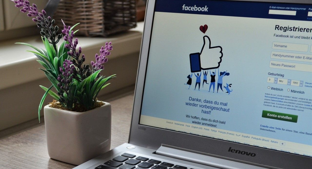 laptop with facebook homepage on screen
