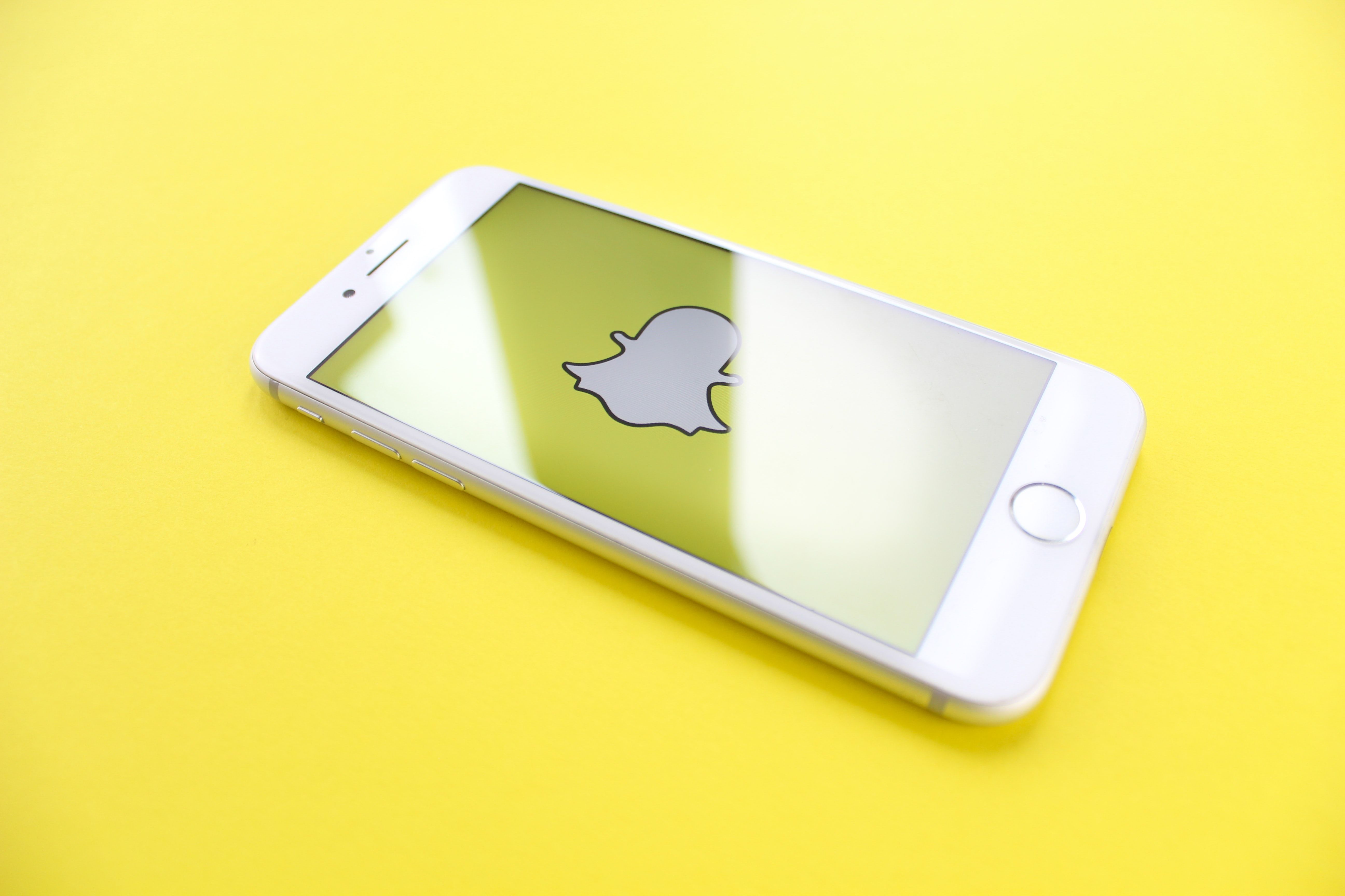Photo of an iPhone showing the Snapchat logo