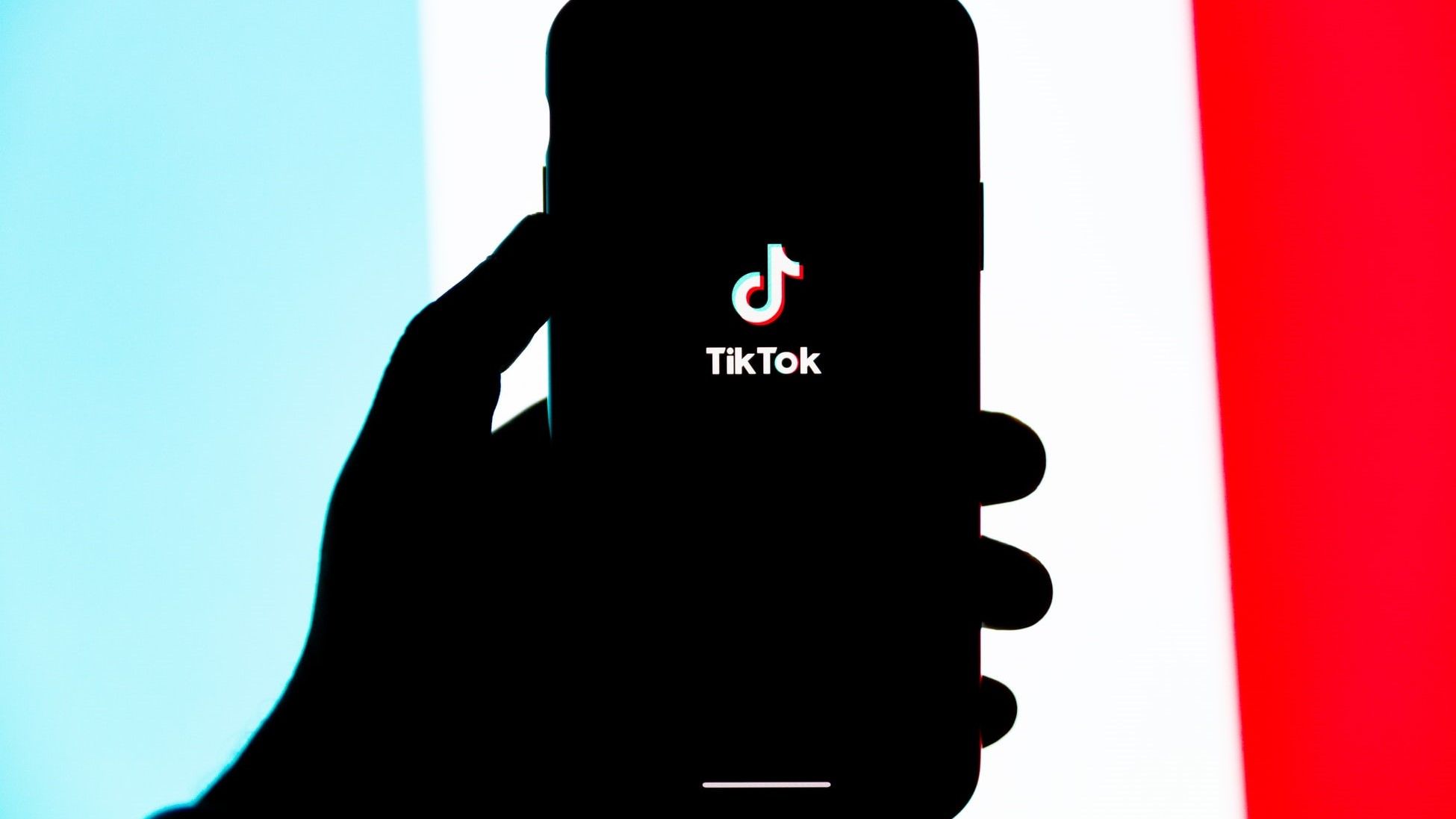 TikTok Logo on Phone Silhouette